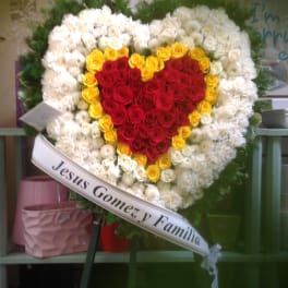 Heart-shaped rose wreath with red center and white outer flowers
