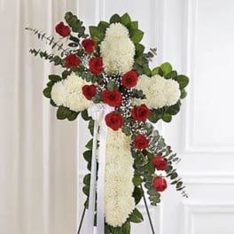 : Cross shape standing spray - made of white football mums w/red rose, baby's breath & eucalyptus break include white bow