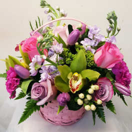 Pink and lavender flower basket with roses and orchids