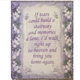 Memorial plaque with a floral border and a sympathy quote