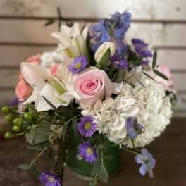 Mixed bouquet with pink roses, white lilies, and purple flowers