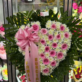 Heart-shaped pink rose and white chrysanthemum standing spray with a pink ribbon