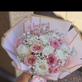 Pink and white rose bouquet with a Happy Birthday topper