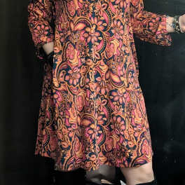 Person wearing a colorful floral-patterned dress