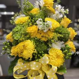 Yellow and white bouquet with a polka-dot ribbon