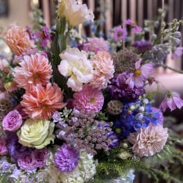 Mixed bouquet of pink, purple, blue, and white flowers