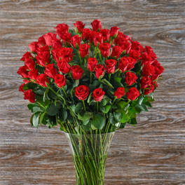 Bouquet of red roses in a clear glass vase