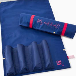 Blue fabric roll-up organizer with pink lettering and trim
