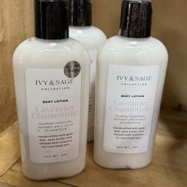Three bottles of Ivy & Sage lavender chamomile body lotion on a shelf