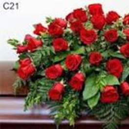Large arrangement of red roses with green foliage