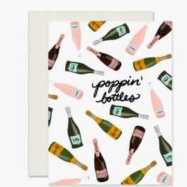 Greeting card with illustrated champagne bottles and the words poppin' bottles