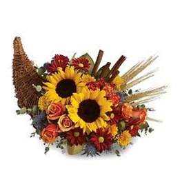 Sunflowers and mixed fall flowers arranged in a cornucopia basket