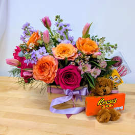 Mixed bouquet in a wooden box with a teddy bear and candy box