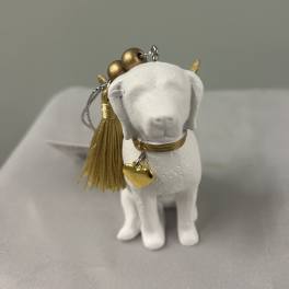 Small white dog figurine ornament with gold tassel and heart charm