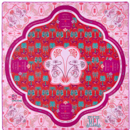 Decorative pink and red patterned scarf with ornate floral motifs