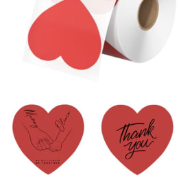 Rolls of heart-printed wrapping paper in red and white