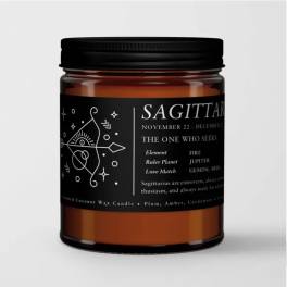 Amber candle in a black-lidded jar with a Sagittarius label