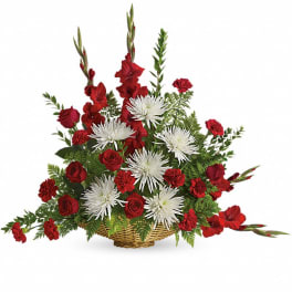 Red roses and white spider mums in a wicker basket