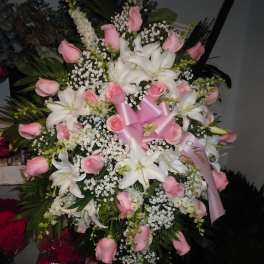Large pink and white floral spray with lilies and roses