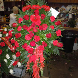 Large red funeral spray with roses and gerbera daisies
