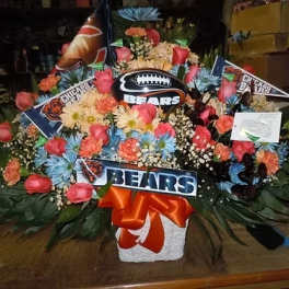 Large floral arrangement with Chicago Bears decorations and a football centerpiece