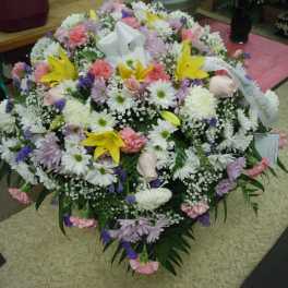 Large mixed flower spray with white, pink, purple, and yellow blooms