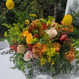 Large mixed bouquet with orange, white, and yellow flowers