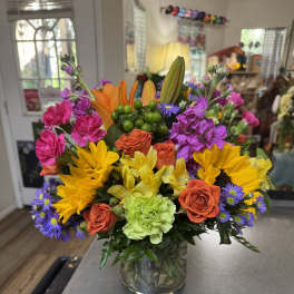Colorful mixed bouquet in a clear glass vase