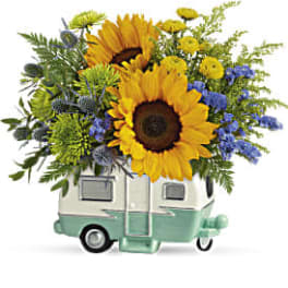 Sunflower bouquet in a small camper-shaped container