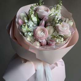 Pink and white bouquet wrapped in pale pink paper