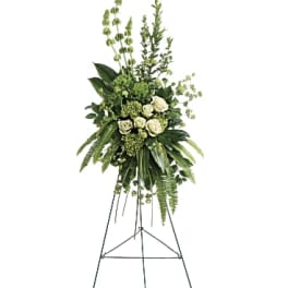 Tall white rose standing spray on an easel with greenery