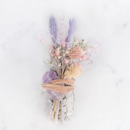 Pastel bouquet with lavender and pink dried flowers wrapped in ribbon