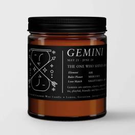 Black-labeled Gemini candle in an amber glass jar with a black lid