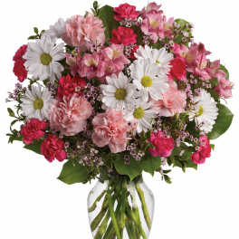 Pink and white mixed bouquet in a clear glass vase