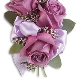 Lavender rose boutonniere with satin ribbon and small filler flowers