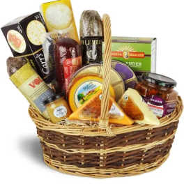 Basket of assorted cheeses and jars of preserves