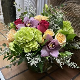 Mixed bouquet with roses, hydrangea, and orchids