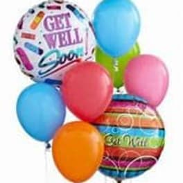 Cluster of colorful balloons with two printed get-well messages