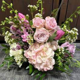 Pink and white floral arrangement with roses and hydrangea