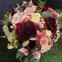 Bouquet of burgundy, blush, and cream flowers with eucalyptus