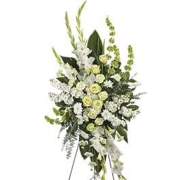 White and pale green standing floral spray on an easel
