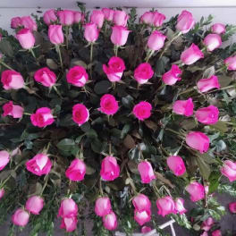 Large arrangement of pink roses viewed from above