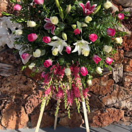 Standing floral spray with pink and white roses and lilies