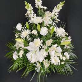 White floral spray with lilies and tall snapdragons