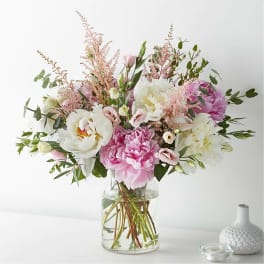 Pink and white mixed bouquet in a clear glass vase