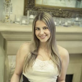 Woman holding a clear box of red roses