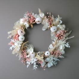 Circular floral wreath with pale pink and white dried flowers