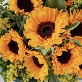 Bouquet of orange sunflowers with yellow filler flowers