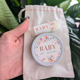 Baby in bloom lip balm and tin in a small drawstring pouch