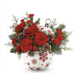 Red roses and carnations in a white ornament vase with pinecones